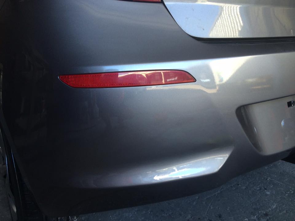 Rear quarter scrape, grey hatch: Flat, glossy and back to a single unbroken panel line.