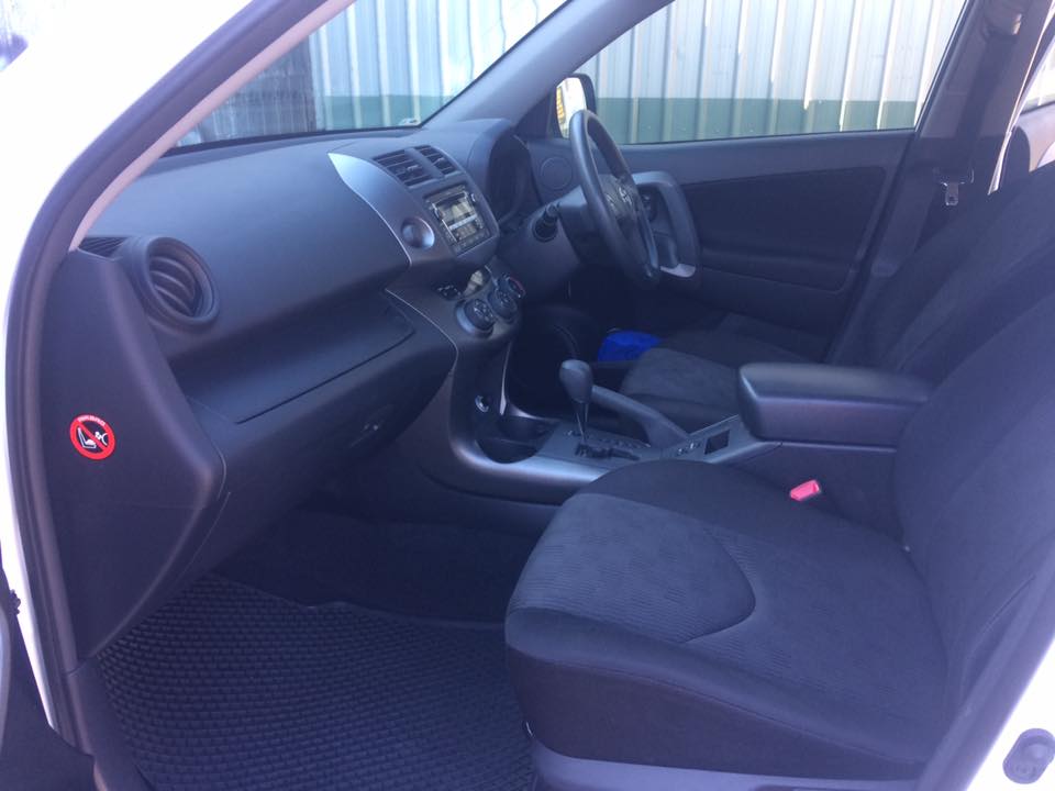 A cleaned dashboard, console and front seats in a Toyota RAV4